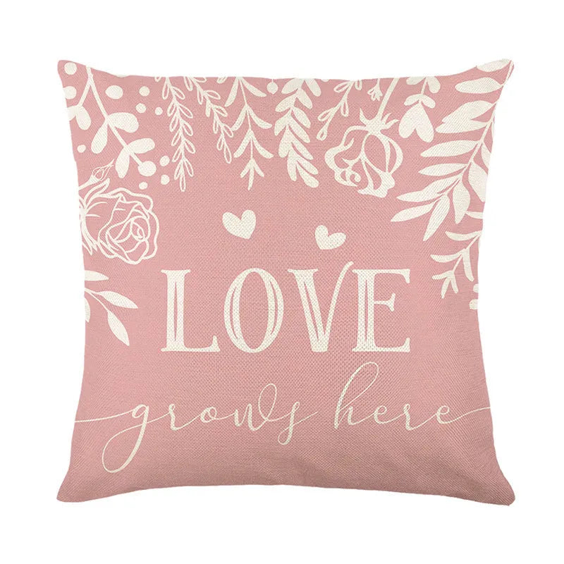 Square red and white plaid heart printed Valentine's Day pillow cover on a sofa.