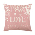 Square red and white plaid heart printed Valentine's Day pillow cover on a sofa.