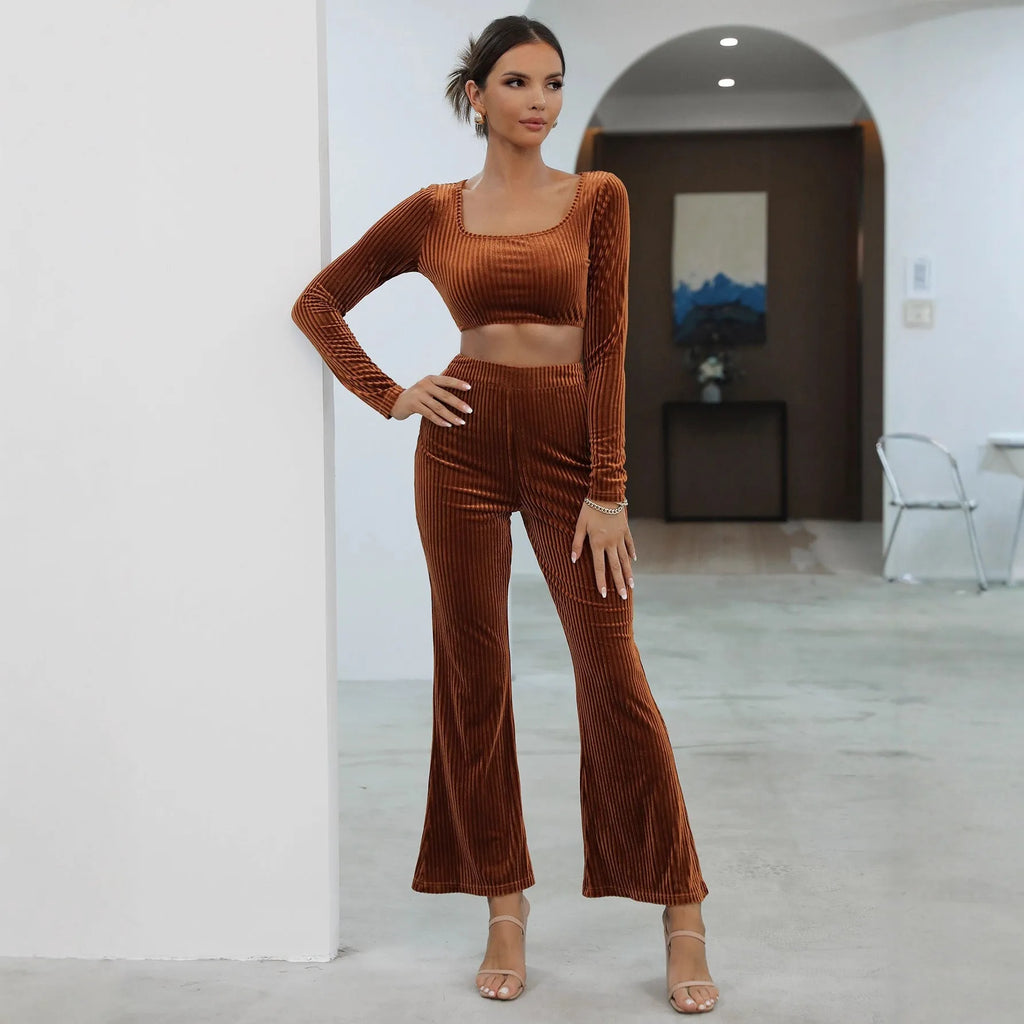 Caramel coloured women's long sleeve sweater set with matching trousers on a hanger.
