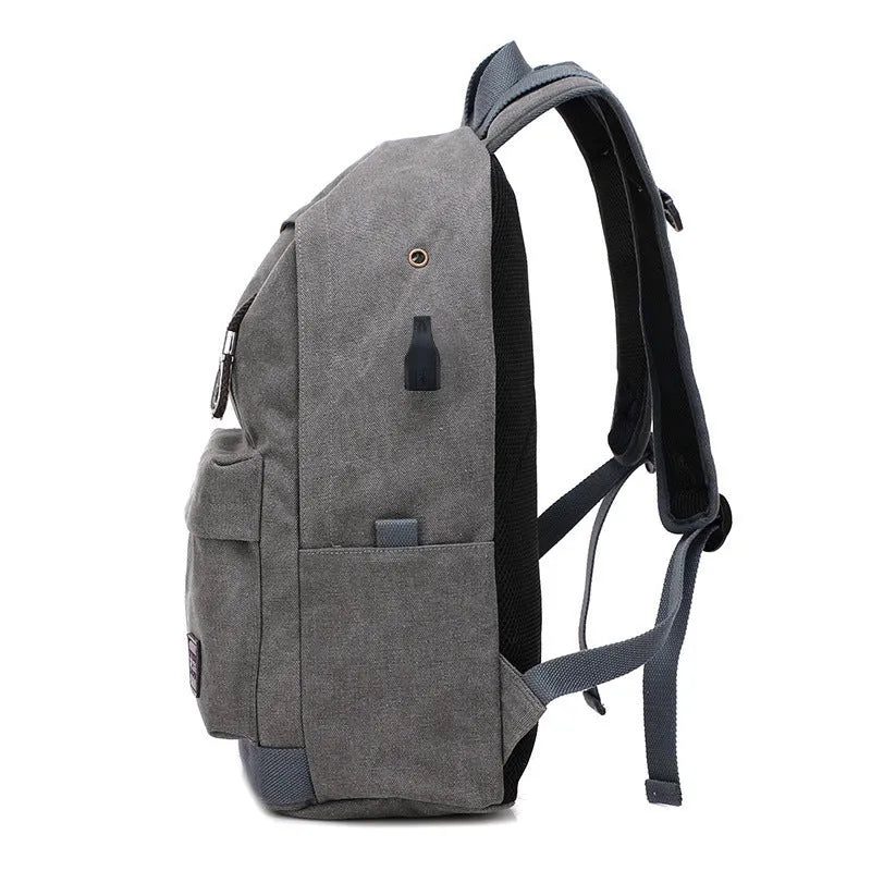 Canvas backpack with USB charging port and shoulder straps in khaki colour.