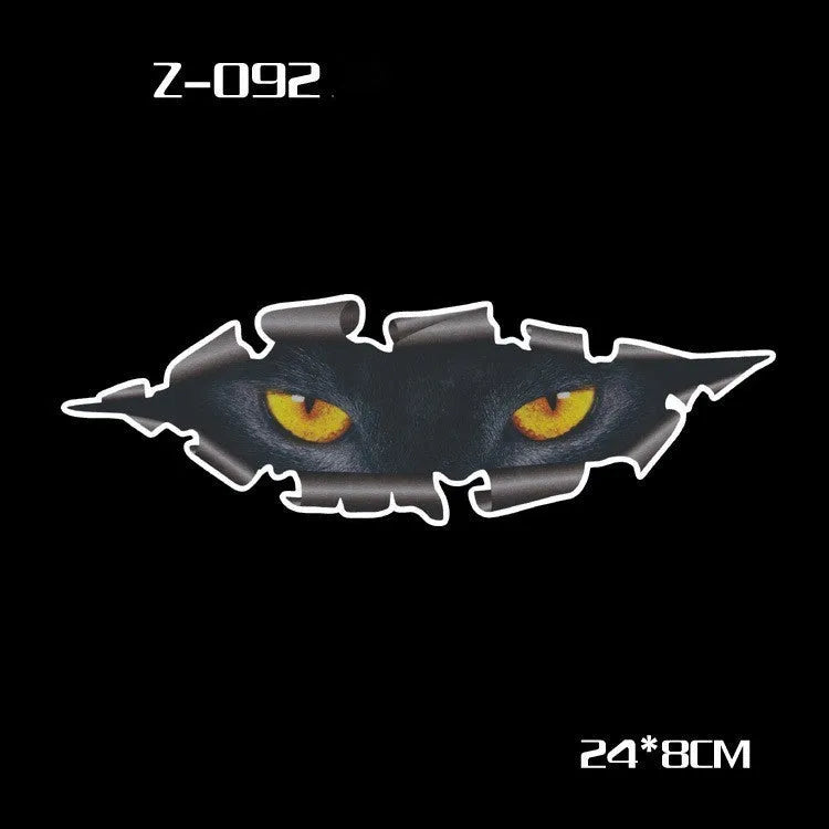 A pair of reflective cartoon car eye stickers on a vehicle body.