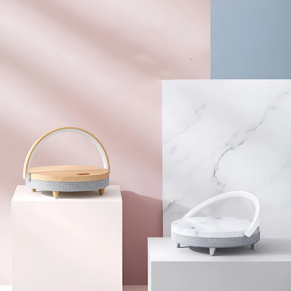 Marble pattern wireless charging night light with Bluetooth speaker and phone holder on bedside table