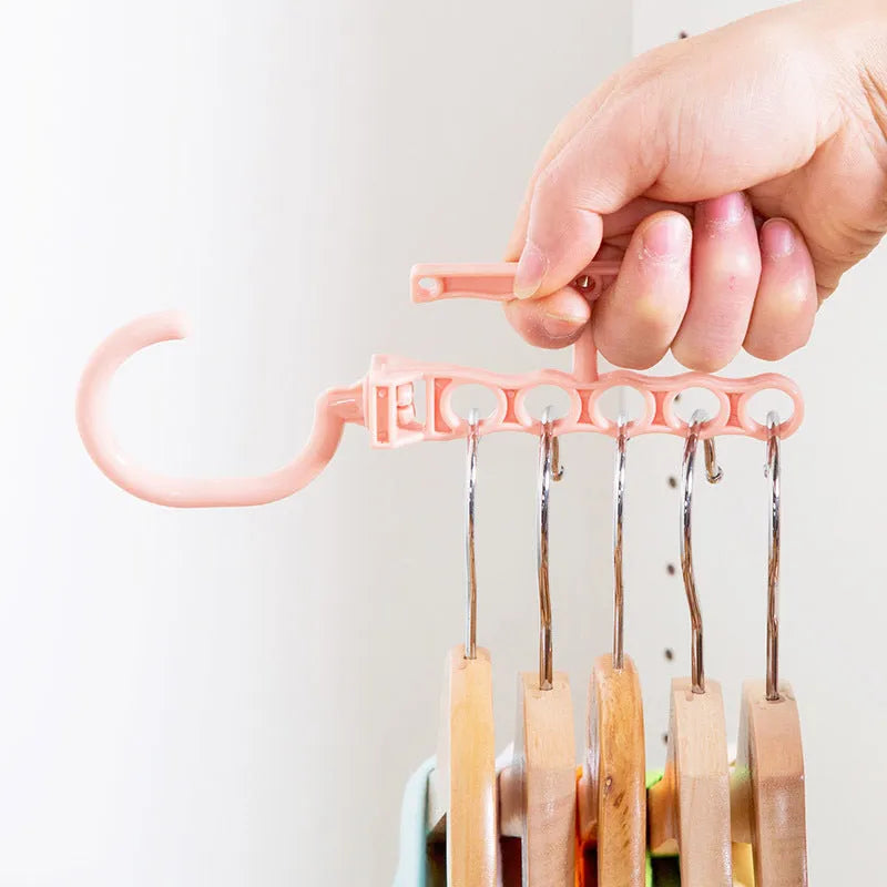 Blue revolving wardrobe hanger with five holes and a handle, made from PP plastic.