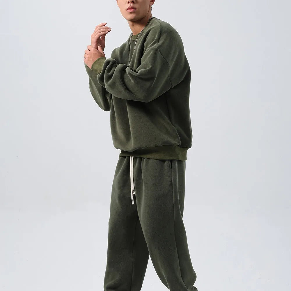 Men's black polar fleece sports suit with padded crew-neck coat and matching trousers