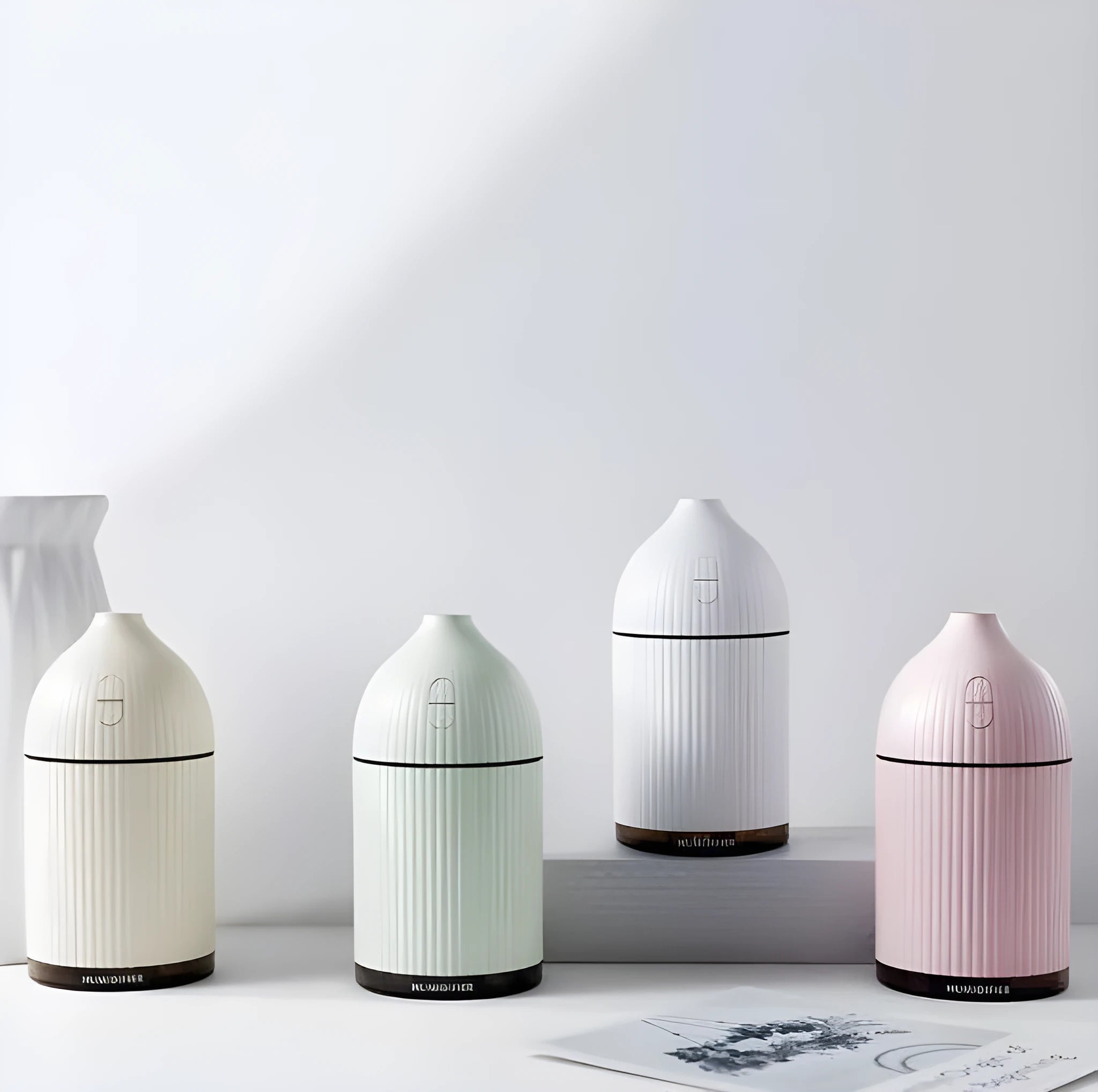 White USB aromatherapy diffuser and humidifier with LED light, 300ml capacity, 80mm cube dimensions.