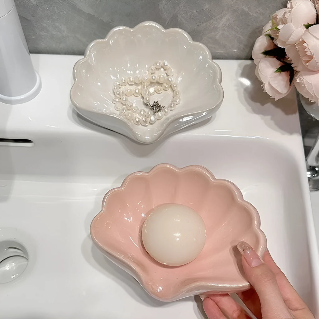 White shell-shaped plastic soap dish for bathroom counter