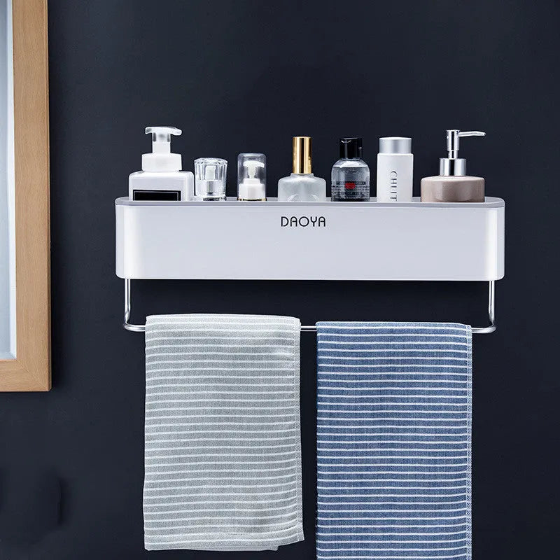 Black wall-mounted bathroom shelf with hole-free installation holding shampoo and shower gel bottles
