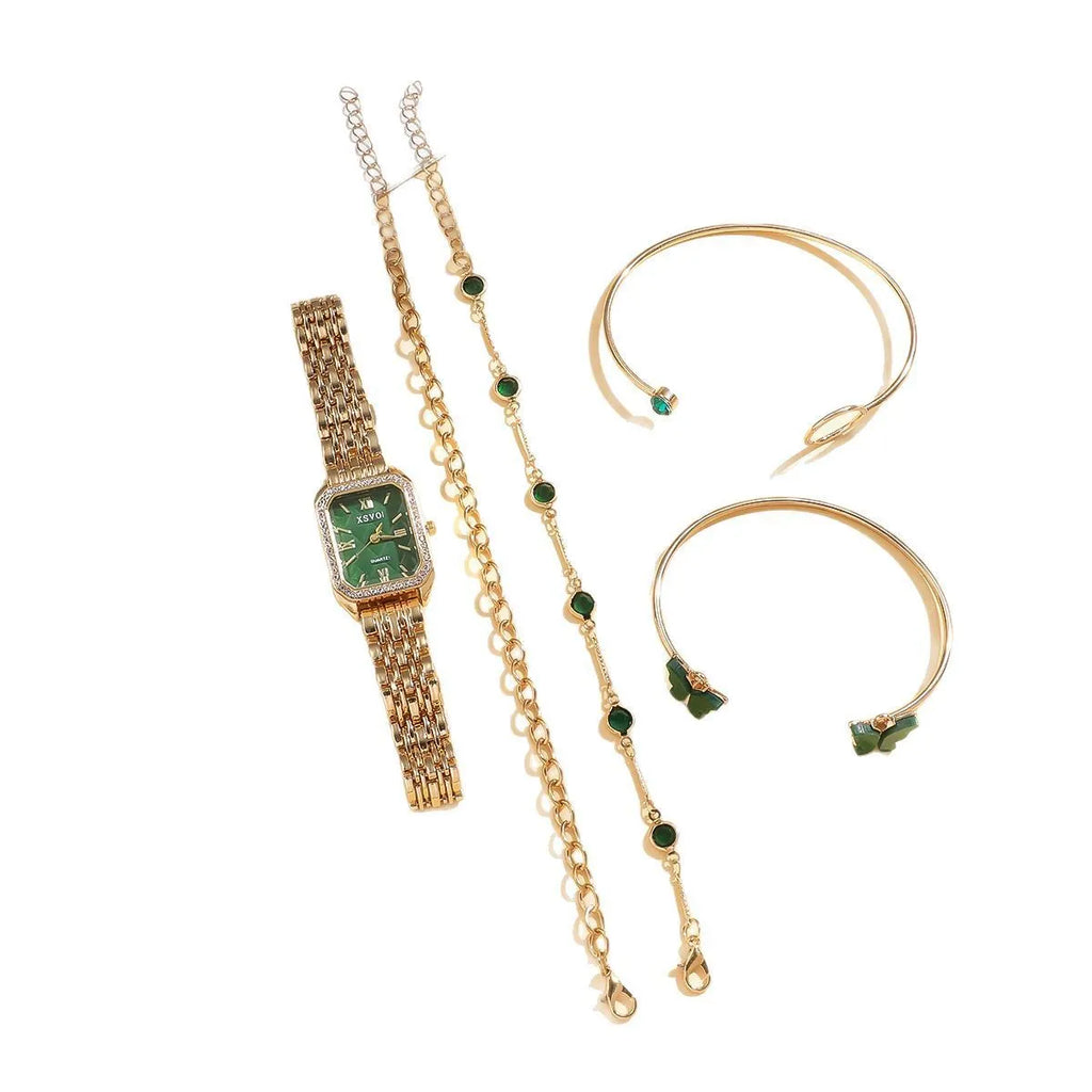 Gold green square women's watch with four matching bracelets on display