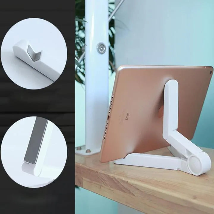 Black foldable tablet holder open in landscape mode holding a smartphone, showing its adjustable angle and non-slip base.