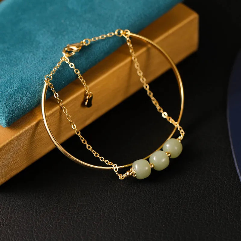 Women's jade lucky beads bracelet with gold inlay, showing single, double, and three bead version options.