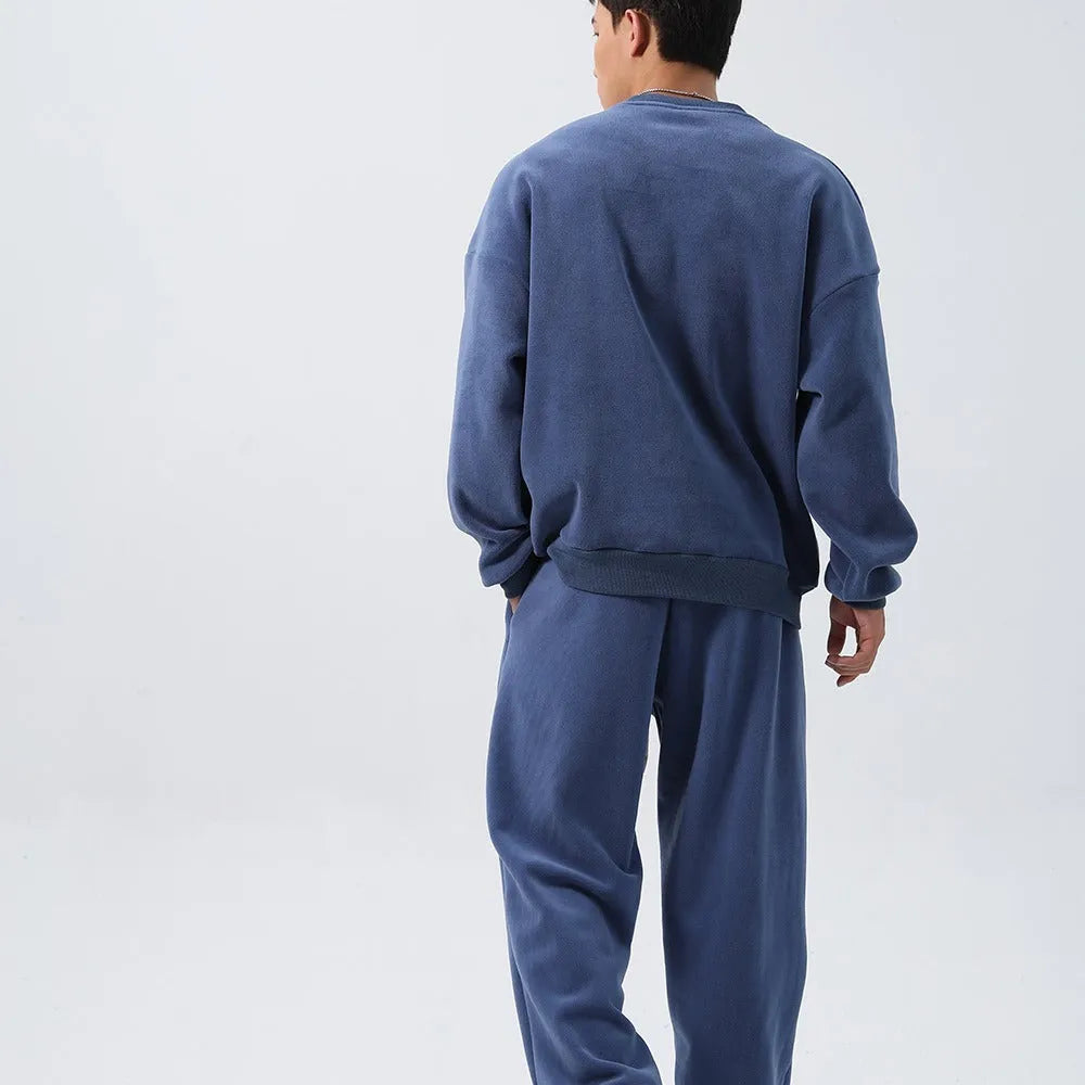 Men's black polar fleece sports suit with padded crew-neck coat and matching trousers
