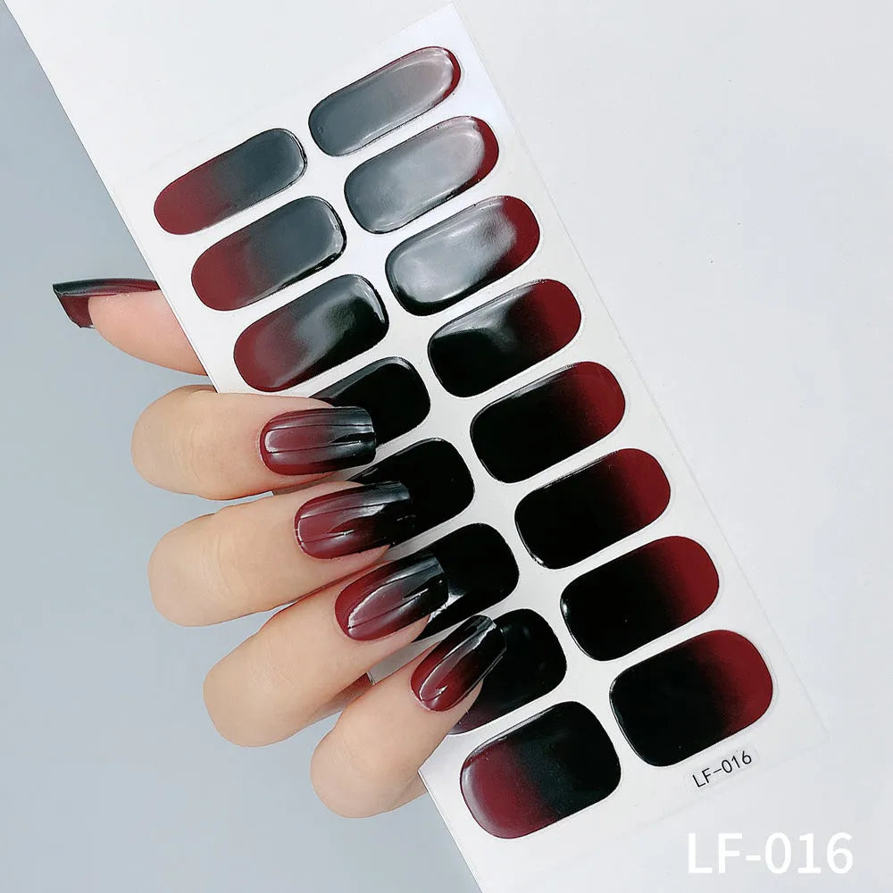Full coverage nail art stickers sheet with 16 designs including cross, rose, tulip, and cartoon patterns.