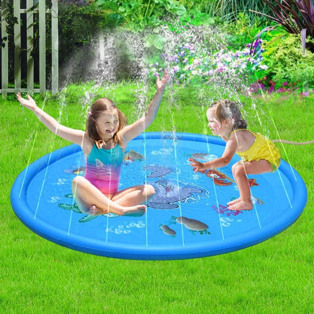 Blue PVC children's water spray mat with marine animal graphics, laid flat on grass.