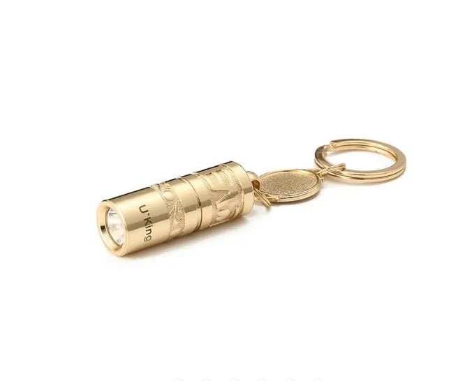 Gold-coloured zinc alloy keychain torch with LED light on a keyring.