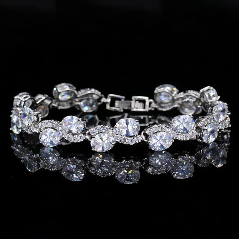 Copper gold plated women's bracelet with white gold colour finish and inlaid AAA zircon stones on a geometric band.