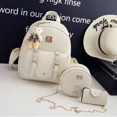 Women's 3-piece floral pattern bag set showing backpack, shoulder bag and card purse in matching design