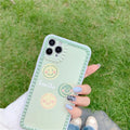 Green geometric pattern TPU iPhone case with polka dot frame and smiley faces, shown from the back.