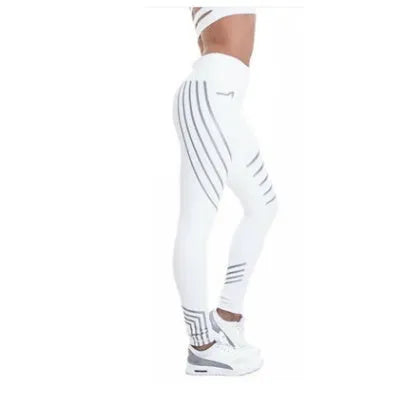 Women's black and white workout leggings with night glowing print, showing slim fit pencil pants style.