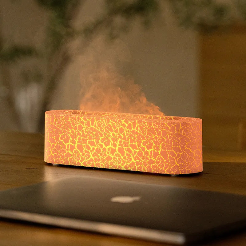 Square creative lava flame atmosphere humidifier and aroma diffuser with colourful LED lights on a desktop.