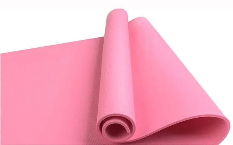 Red EVA fitness yoga mat showing texture and thickness, rolled partially with carry bag.