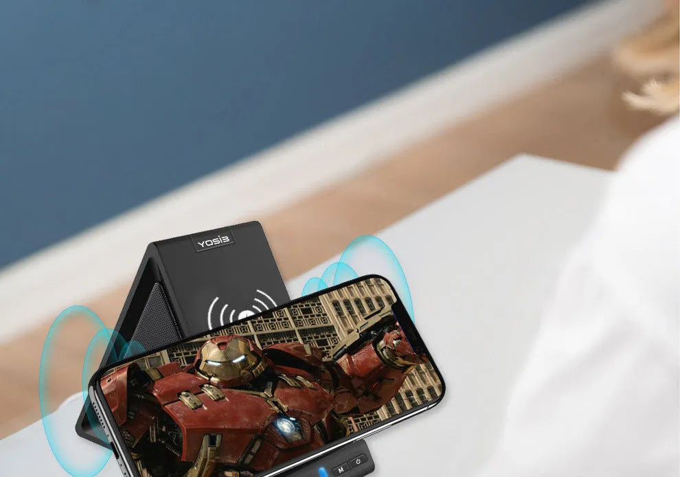 Black multifunction Bluetooth speaker with wireless charging surface and integrated phone stand