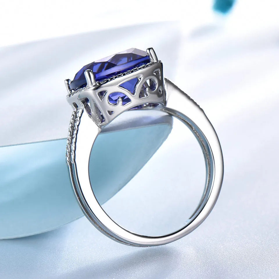Women's sterling silver ring with a blue Tanzanite gemstone, shown in size 10.