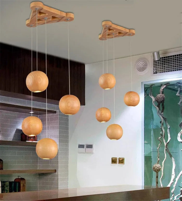 Nordic style wood ball chandelier with adjustable hanging height and solid wood construction for living room
