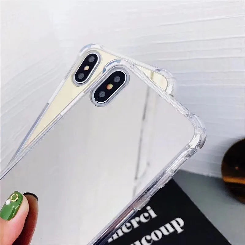 Soft TPU Mirror Phone Case for iPhone in multiple colours on a table.