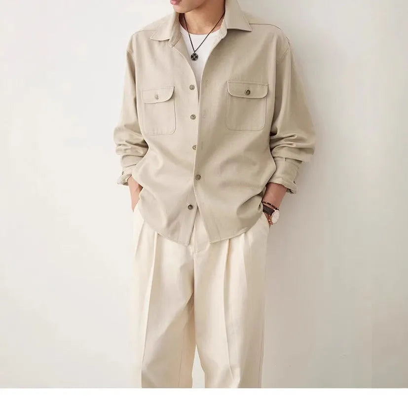 Men's light sand rice coloured lapel collar long sleeve casual shirt on a hanger.