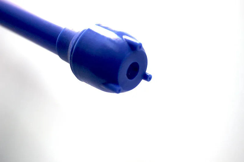 Red and blue manual hand pump siphon for transferring fuel oil and gasoline