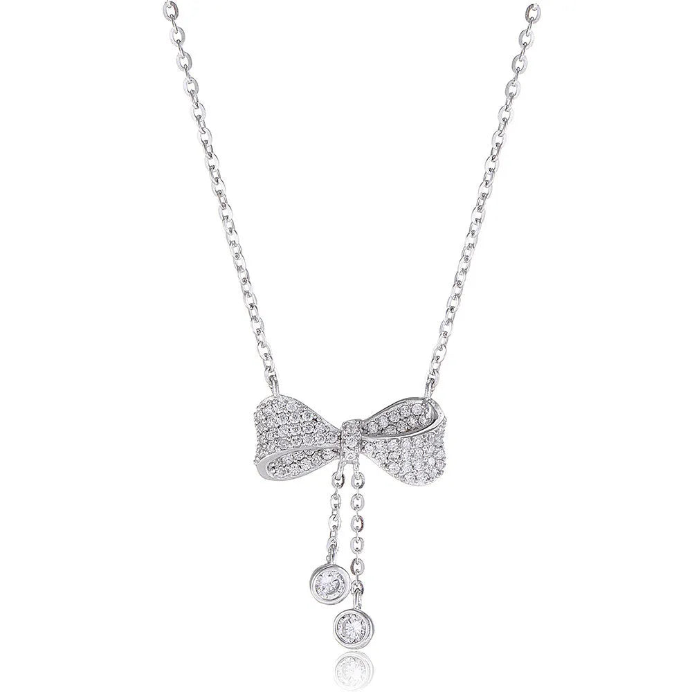 Silver bow necklace on adjustable chain showing pendant detail and polished finish