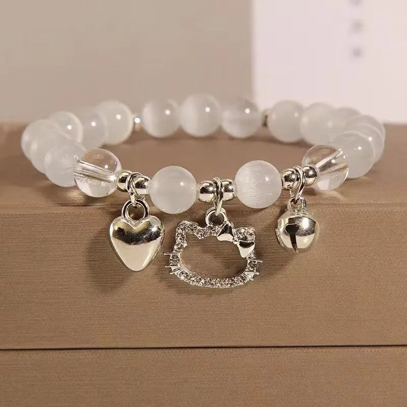 A Chinese style glass bracelet with bamboo leaf and bead designs on a wrist.