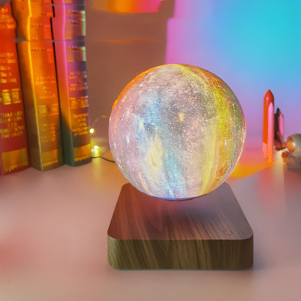 Magnetic levitation galaxy decorative light with rotating moon lamp above walnut-coloured base
