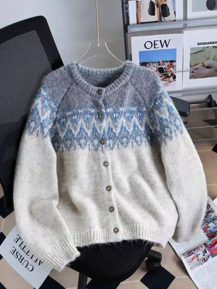 Women's loose-fit jacquard knit sweater coat in milky white, shown with long sleeves and textured pattern.