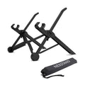 Sagacious black portable folding laptop stand on a wooden desk next to a laptop.