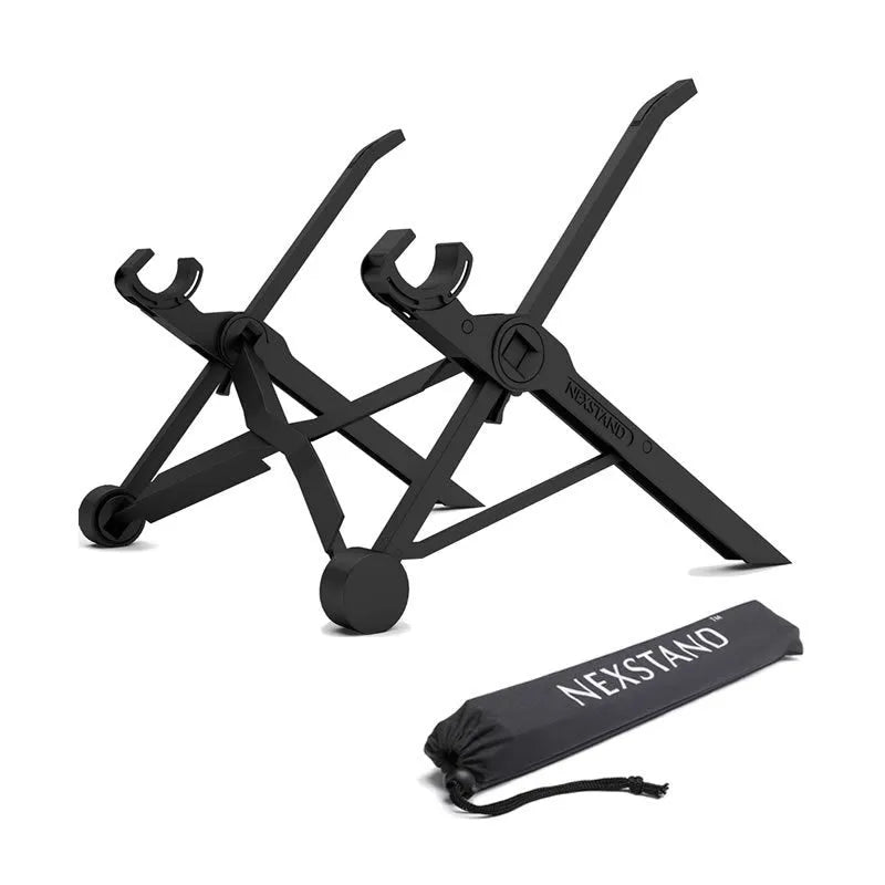 Sagacious black portable folding laptop stand on a wooden desk next to a laptop.