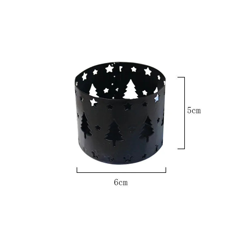 Black iron elk Christmas candlestick holder on table with candle