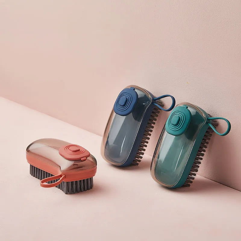 Blue automatic liquid cleaning brush with ergonomic grip for shoes and laundry on a white background.