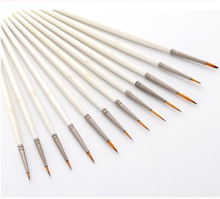 Set of twelve pearl white fluorescent marker pens with nylon wool brush tips for artists.