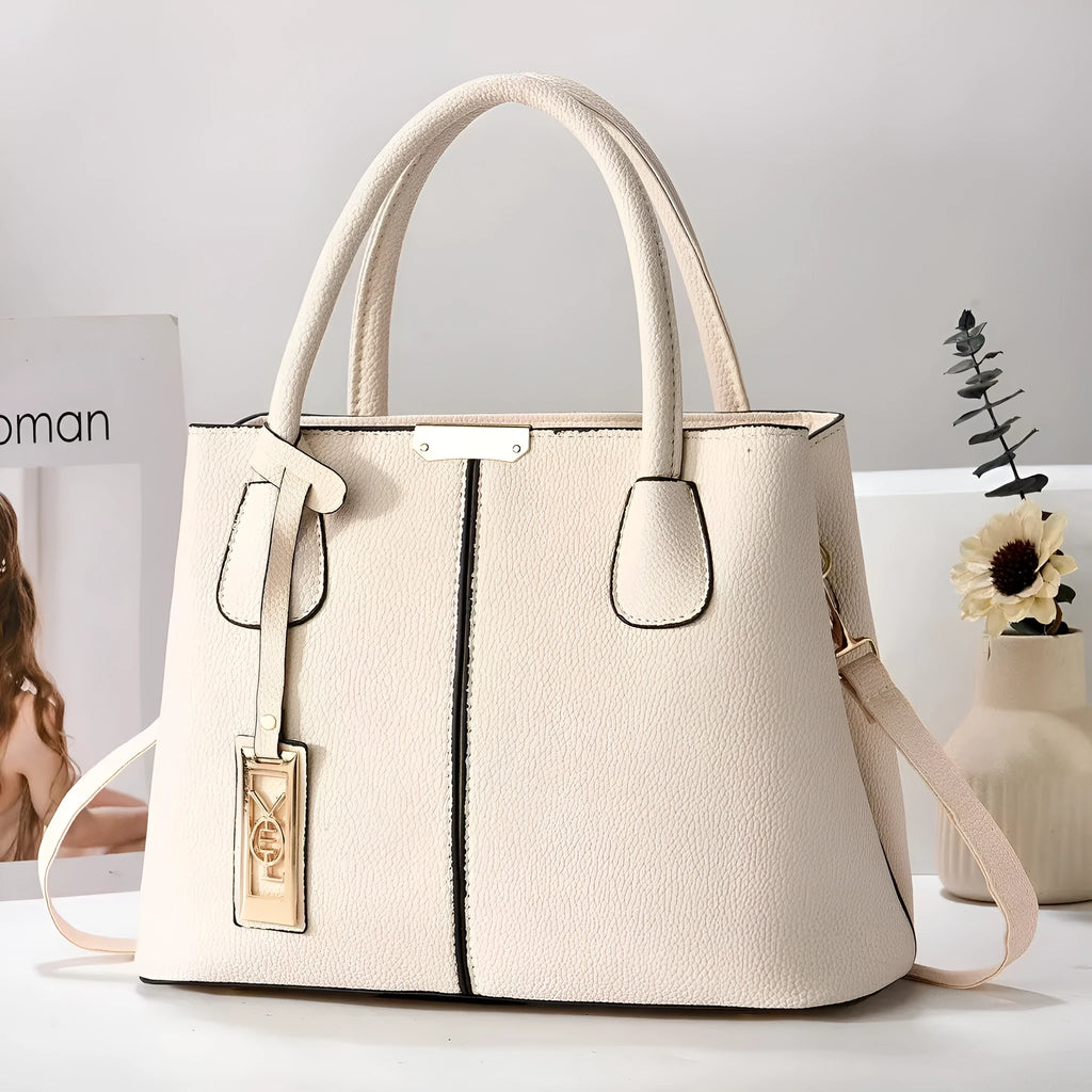 Soft large capacity PU leather shoulder bag in a horizontal square shape with a leather strap.