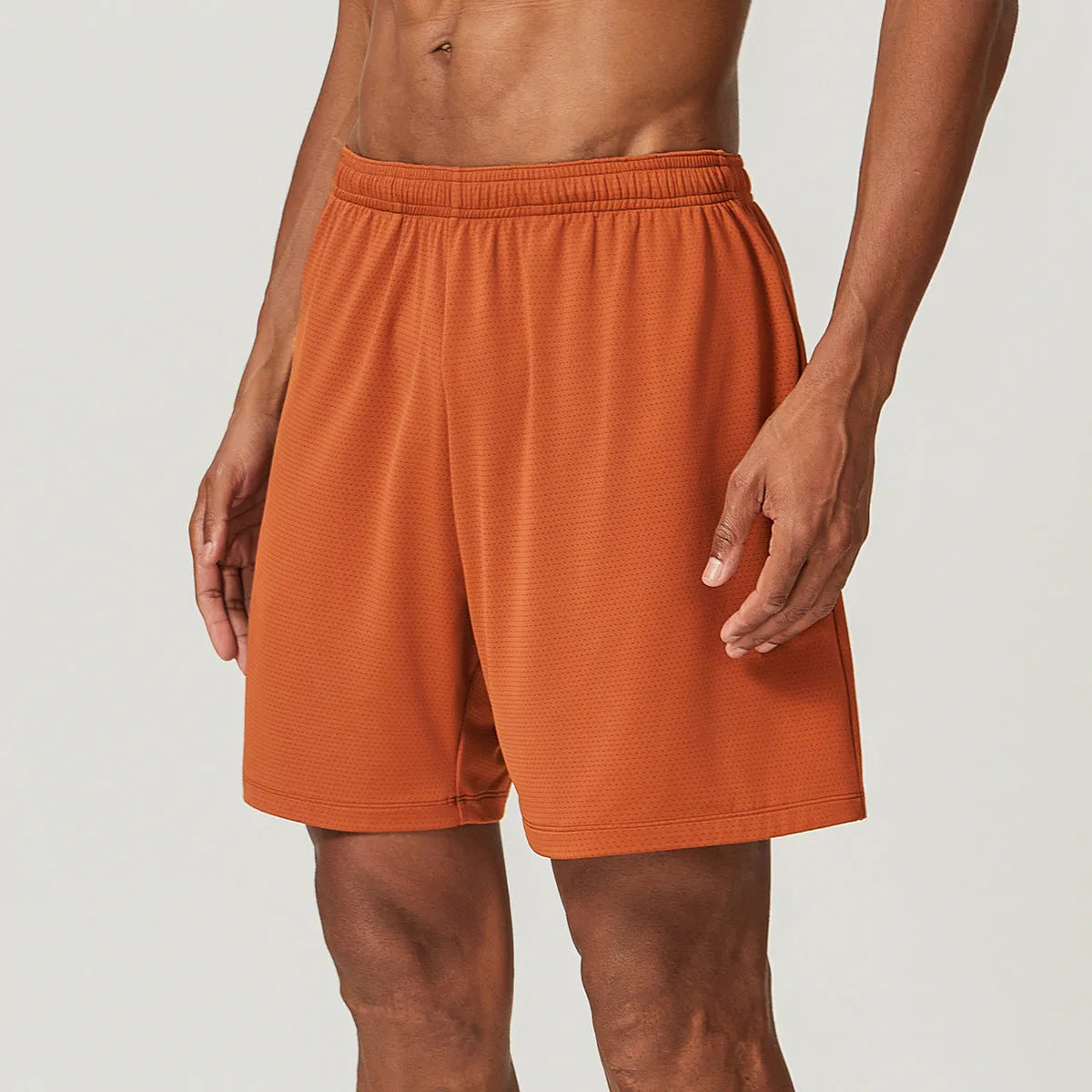 Men's quick-drying double-layer running shorts in khaki colour, showing mid-waist fit and shorts length.