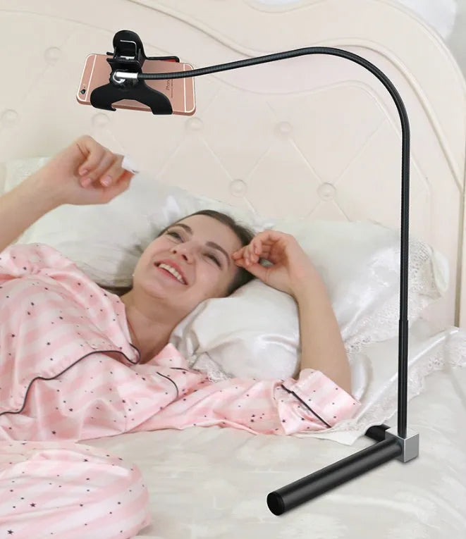 Mobile phone bed bracket with overhead support shelf in black mounted beside bed with phone secured in universal folder