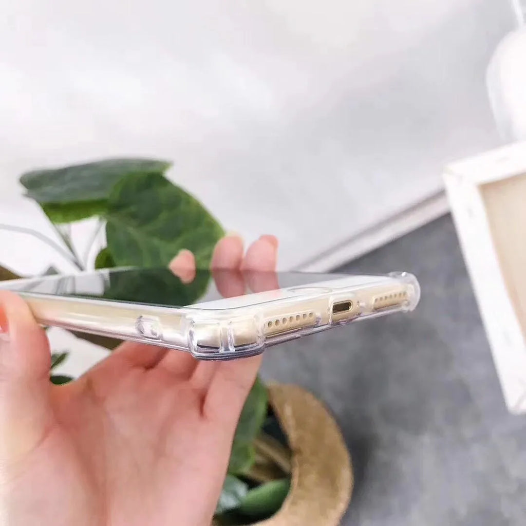 Soft TPU Mirror Phone Case for iPhone in multiple colours on a table.