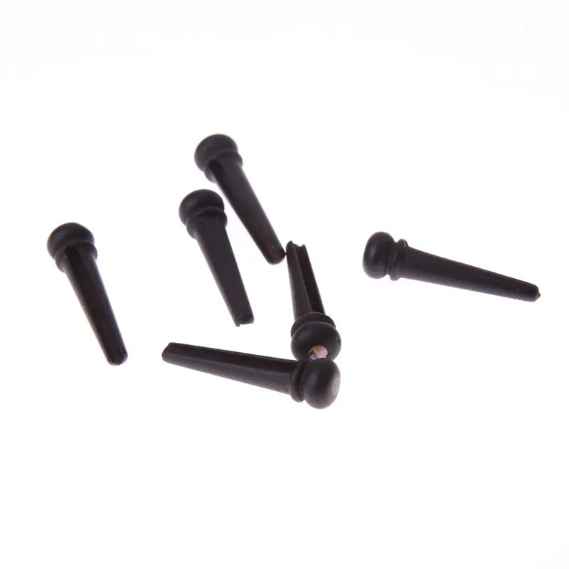 Set of six matt black ebony guitar string nails for folk acoustic instruments