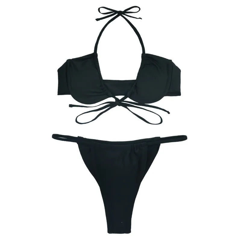 Women's black and mint green nylon two-piece bikini swimsuit set on a white background.