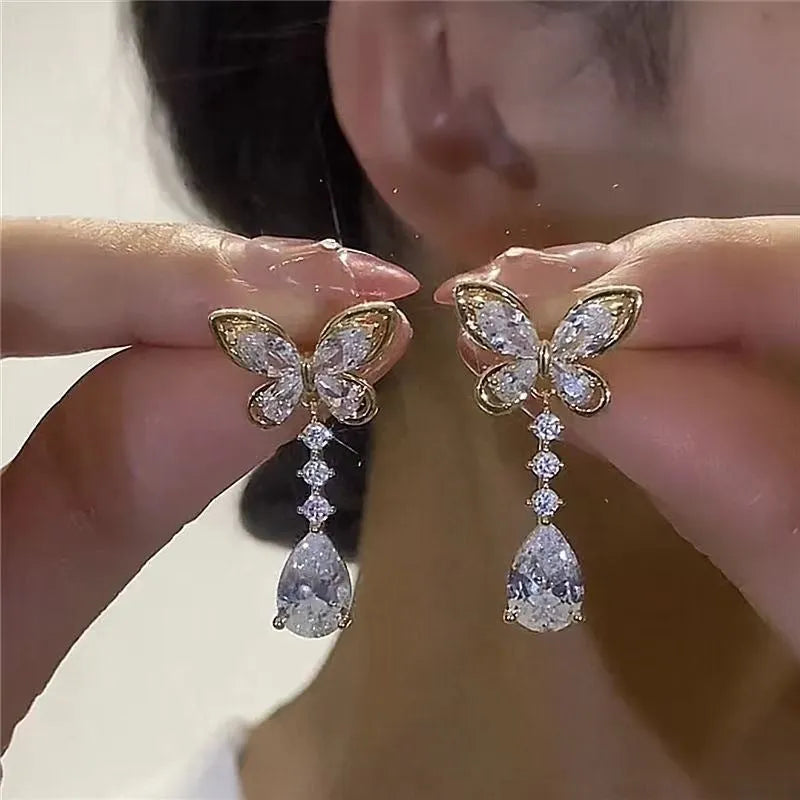 Platinum colour bow stud earrings with zinc alloy construction and electroplated finish