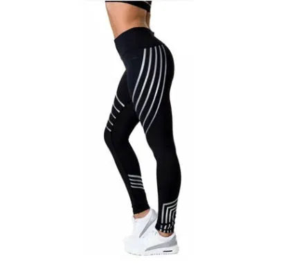 Women's black and white workout leggings with night glowing print, showing slim fit pencil pants style.