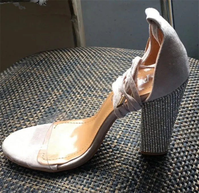 Plastic high heel shoes with pointed toe in black or gold colour on size label
