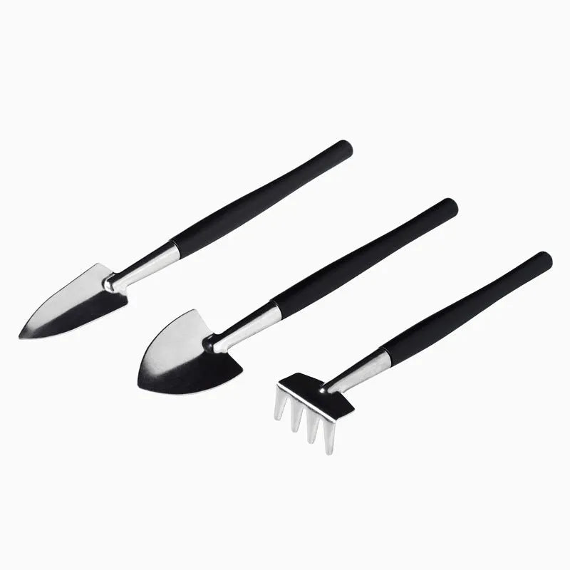 16-piece black succulent garden tool set with cushion, showing scissors, tweezers, shovels, rake, watering bottles, and air blower.
