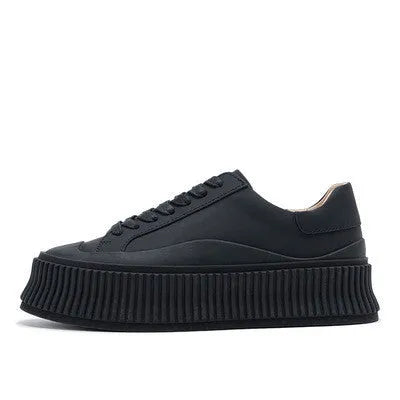 Women's suede platform sneakers with thick rubber soles and cross binding detail in black, white and white-black colour options